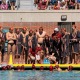USC men's water polo huddles in a 2024 game.