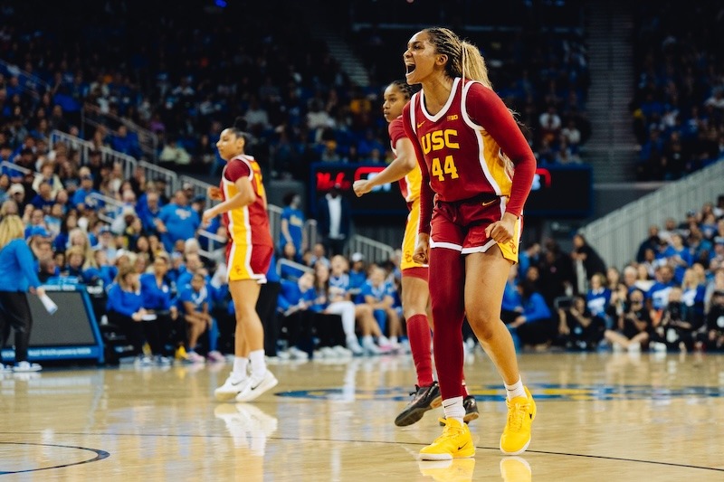 Former USC guard Kiki Iriafen celebrates during a 2024 game.
