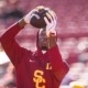 Junior wide receiver Prince Strachan catches a pass in warm ups before USC's game against Michigan.
