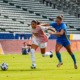Junior forward Maribel Flores tries to shake a UCLA defender in October, 2024.