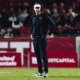 Head Coach Lincoln Riley watches the field in a 2024 game against Rutgers.