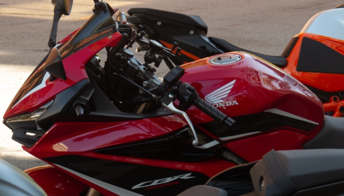 A parked motorcycle sits on the USC campus road. (Luis Ochea / Daily Trojan)