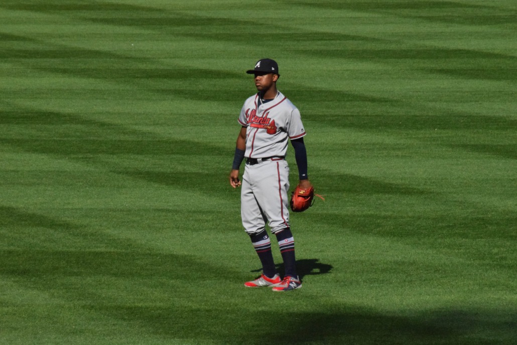 Atlanta Braves outfielder Ronald Acuña Jr. stands in the outfield.