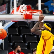 Amarion Dickerson slams a dunk.