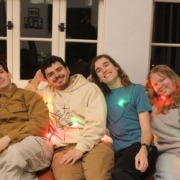 Daily Trojan editors who contributed to the listicle pose in the newsroom.