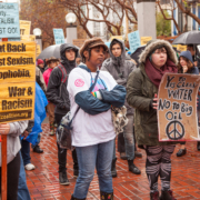 Women carrying protest signs