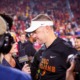 Lincoln Riley talks to reporters during a game against UCLA