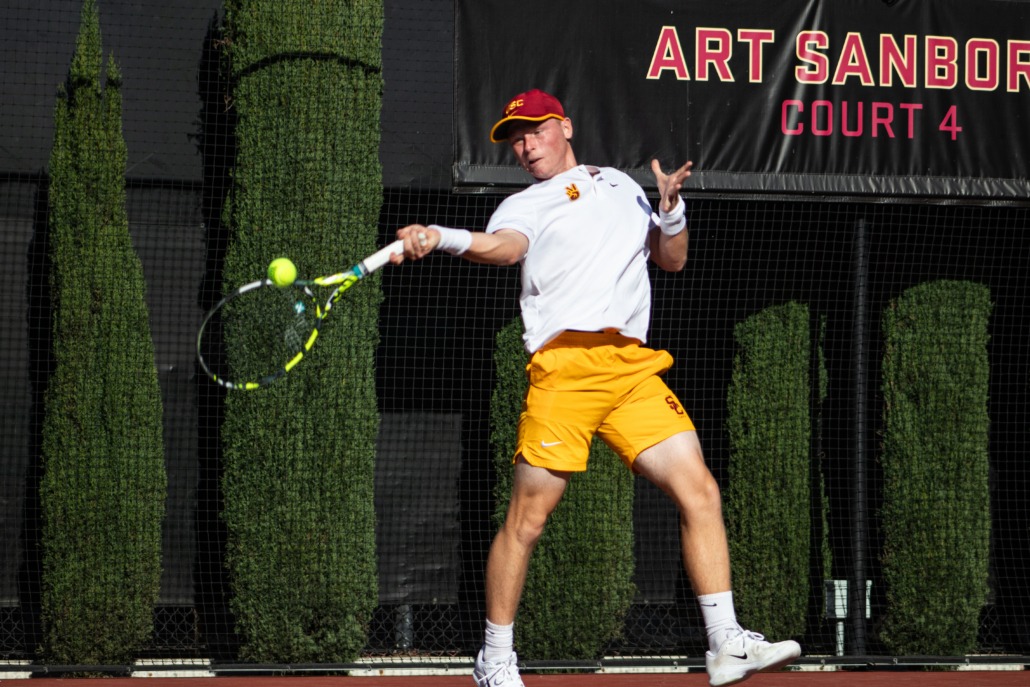 Freshman Max Exsted swings in a match against San Diego