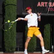 Freshman Max Exsted swings in a match against San Diego