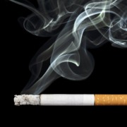 Cigarette with smoke coming out of it