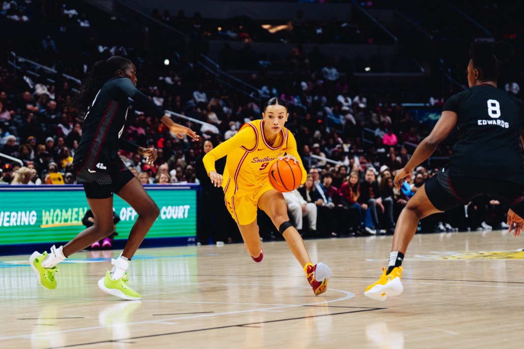 Jazzy Davidson dribbles past two Southern Carolina defenders