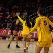 USC women's basketball players defend against Rutgers