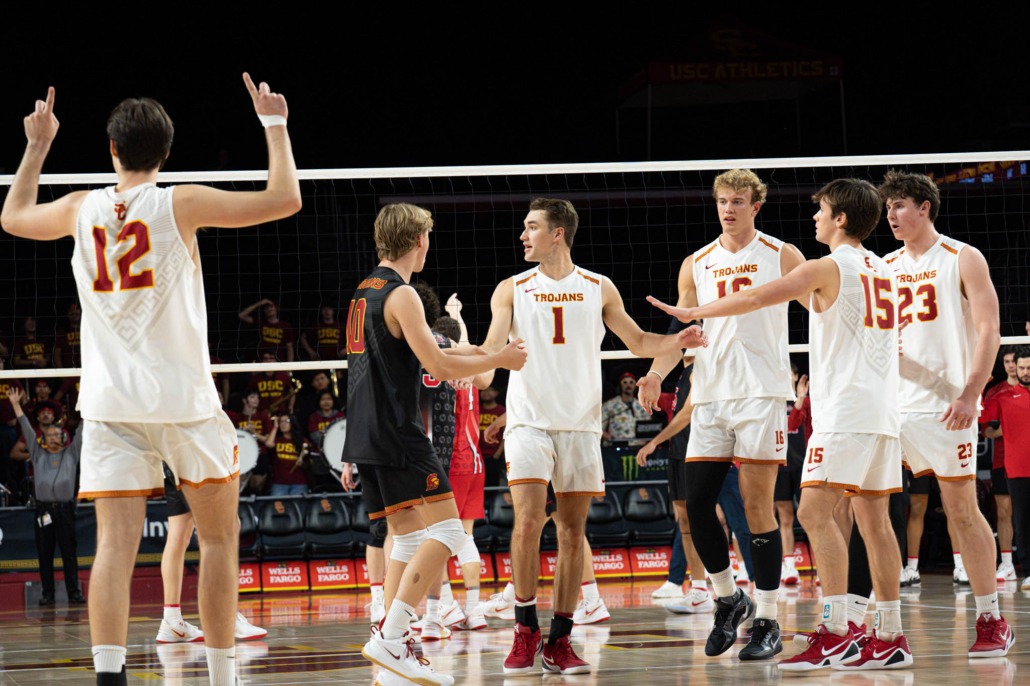 mens volleyball team celebrating after a point
