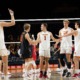 mens volleyball team celebrating after a point
