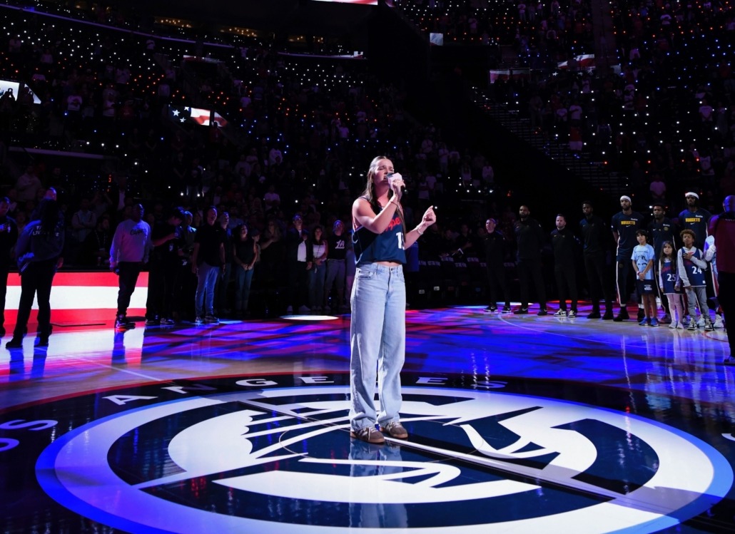 Mia Hart sings the National Anthem at a Clippers basketball game.