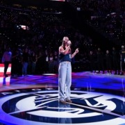 Mia Hart sings the National Anthem at a Clippers basketball game.