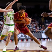 Sophomore forward Jacob Cofie tries to push through the Oregon defense