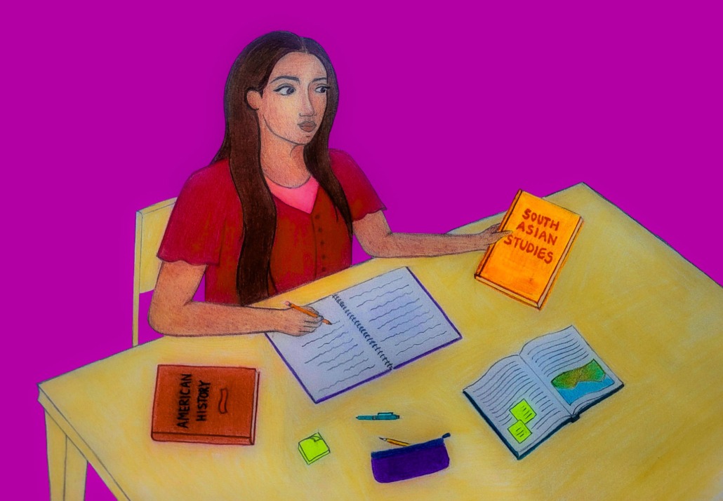 Woman studying South Asian Studies books.