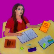 Woman studying South Asian Studies books.