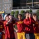 The USC men's tennis team cheers on their teammate