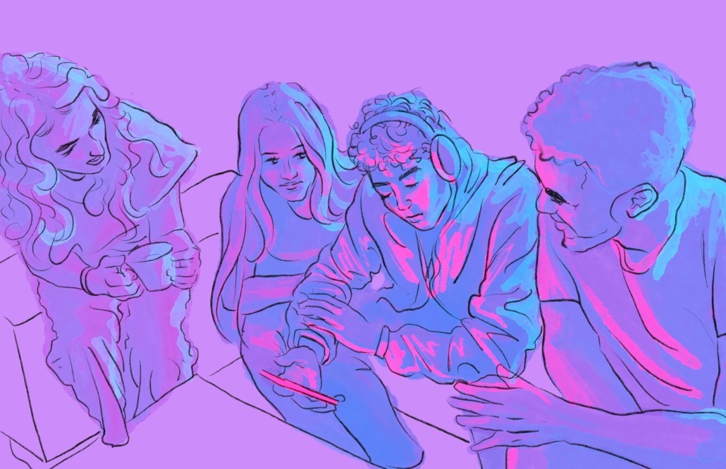 IMG_1377 Four young people huddled around a phone