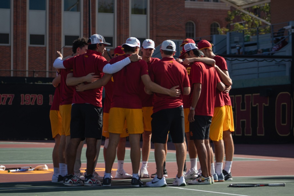 USC men's tennis huddles before a match