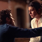 Poppy Wright cries and Alex Nilsen consoles her in the film "People We Meet on Vacation."