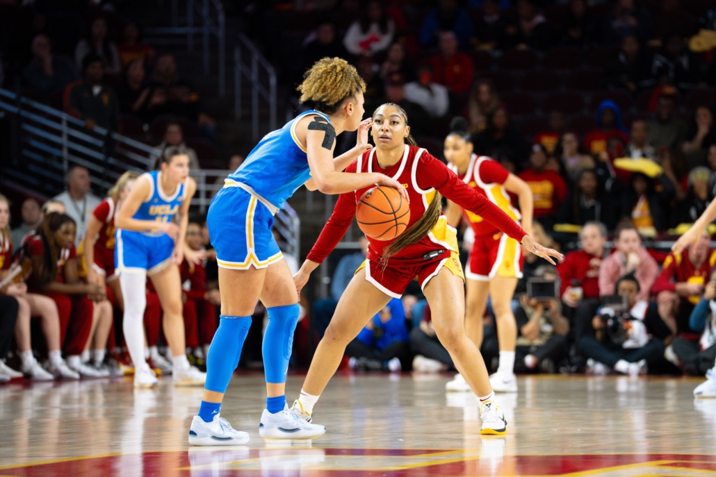 USC guard Kennedy Smith guarding UCLA guard Kiki Rice.