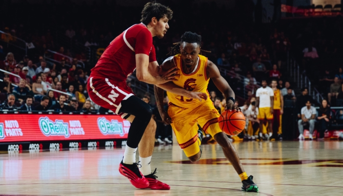 Kam Woods drives to the basket.