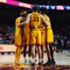 The team huddles after a play.