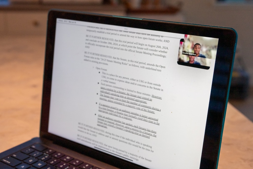 A photo of a computer with USG members meeting virtually