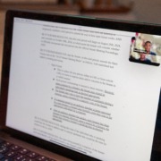 A photo of a computer with USG members meeting virtually