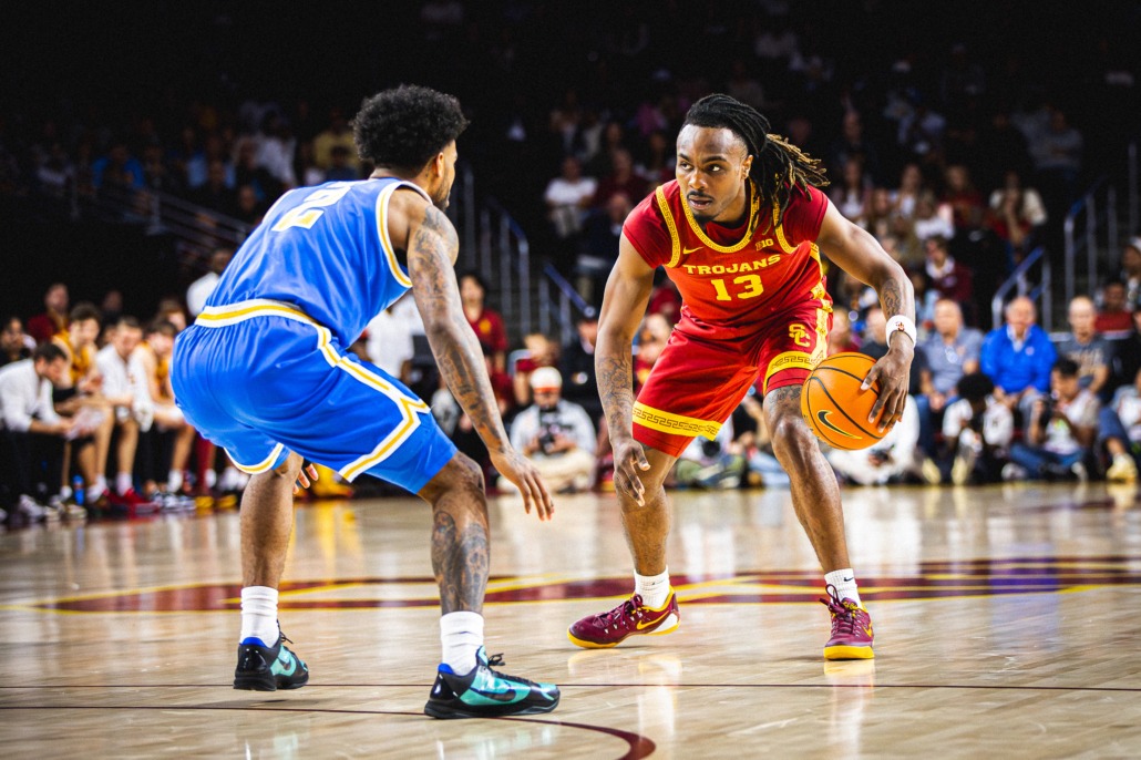 USC graduate guard Kam Woods stares down UCLA senior guard Donovan Dent