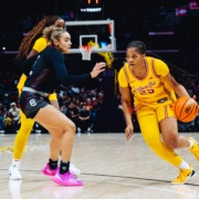 Kara Dunn dribbles past a defender