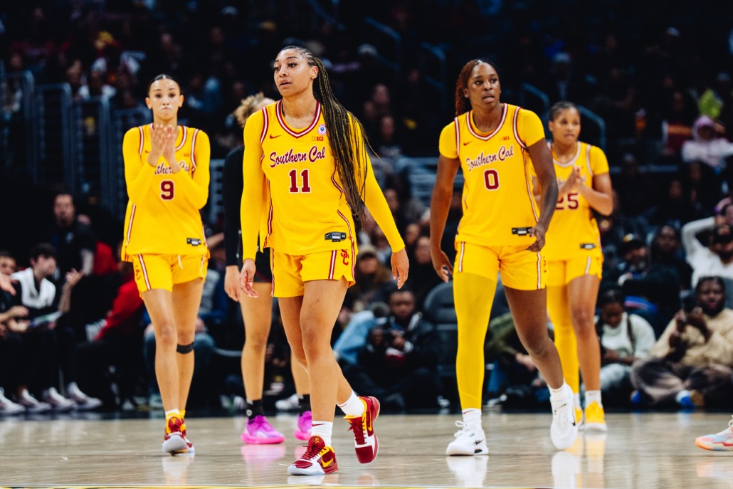The USC women's basketball team walks across the court after a loss to South Carolina