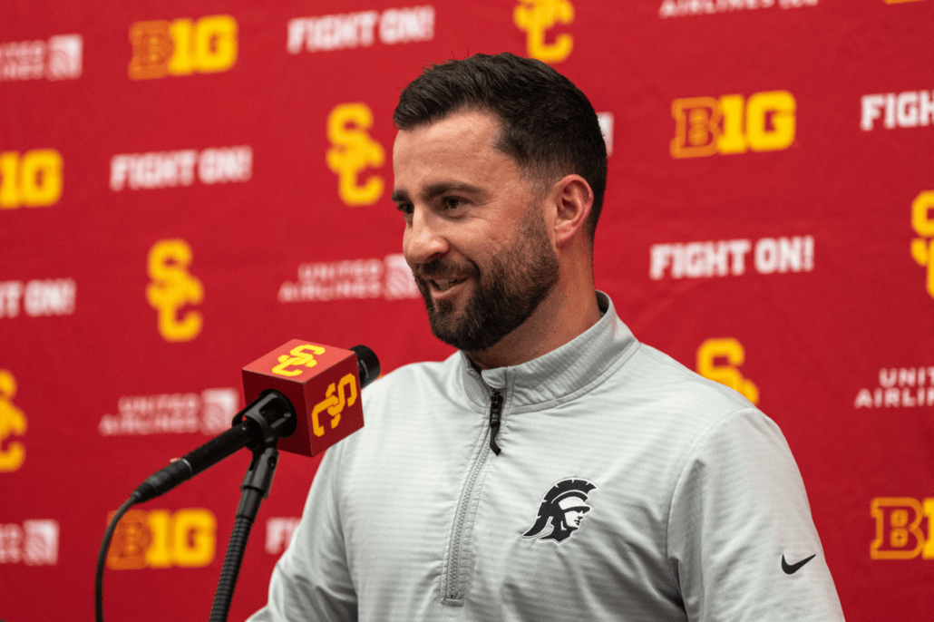 Inside receiver and tight ends coach Chad Savage speaks at a news conference