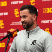 Inside receiver and tight ends coach Chad Savage speaks at a news conference