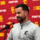 Inside receiver and tight ends coach Chad Savage speaks at a news conference