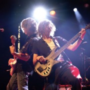 A guitarist and a bass player play together onstage at the pop showcase.