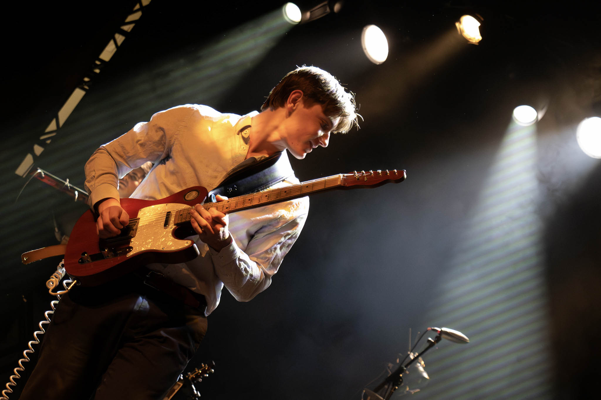 A guitarist plays on stage at the pop showcase.