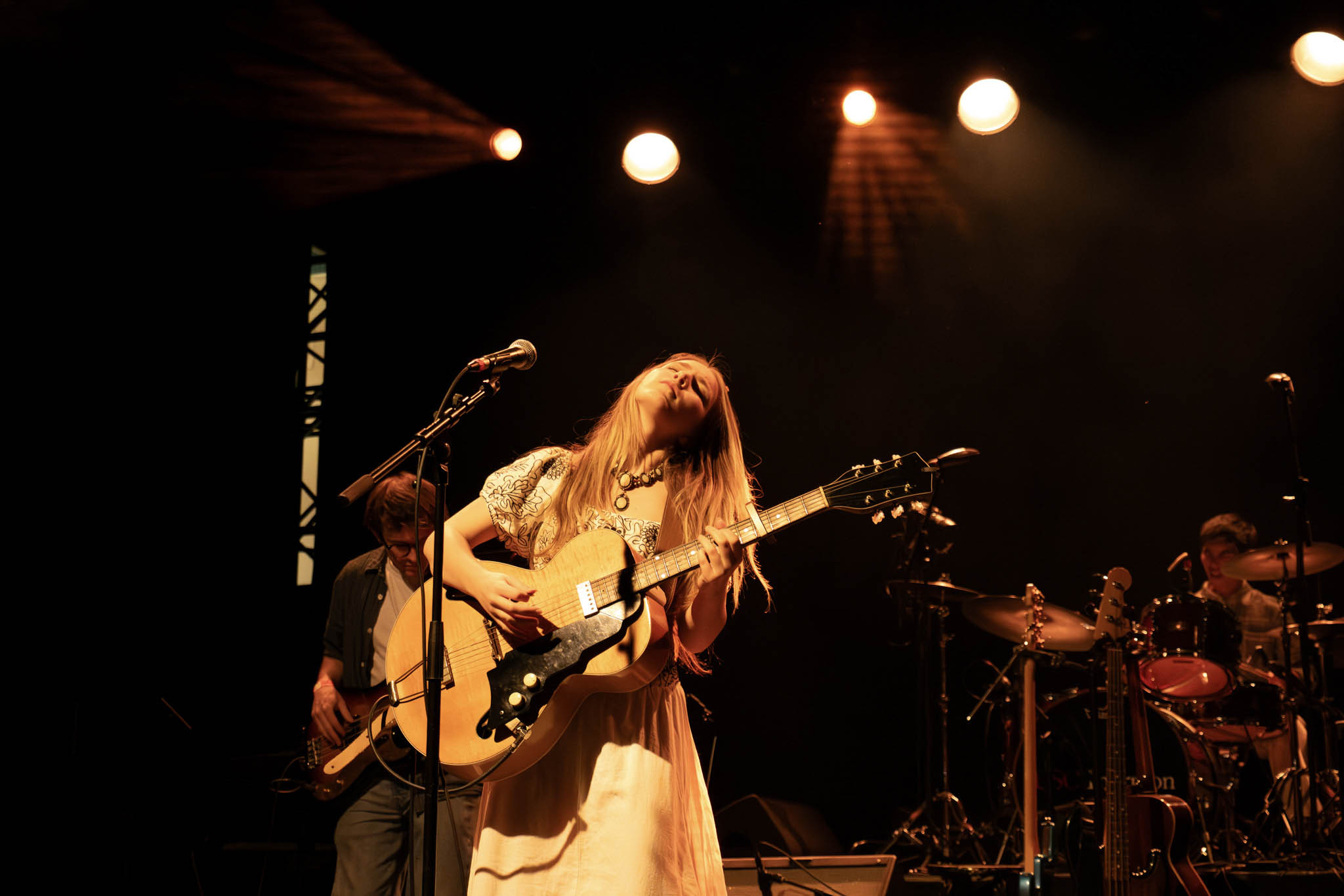 A guitarist and singer performs at the pop showcase.