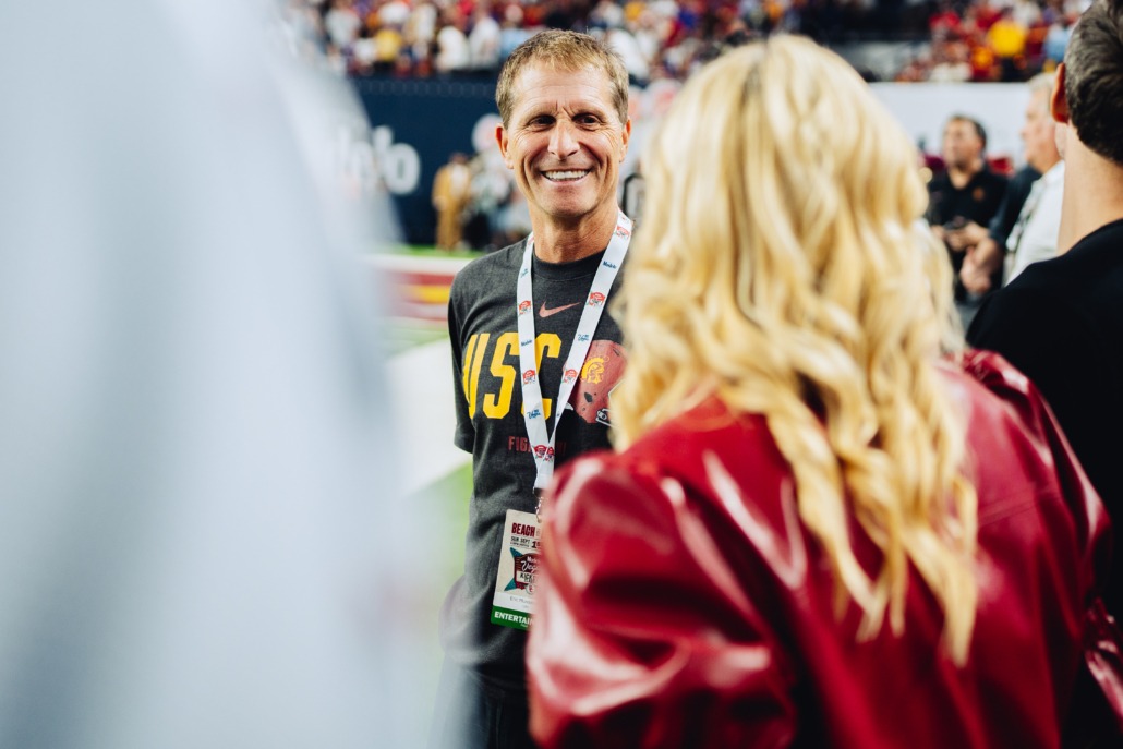 Head Coach Eric Musselman talks with Athletic Director Jennifer Cohen