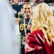 Head Coach Eric Musselman talks with Athletic Director Jennifer Cohen