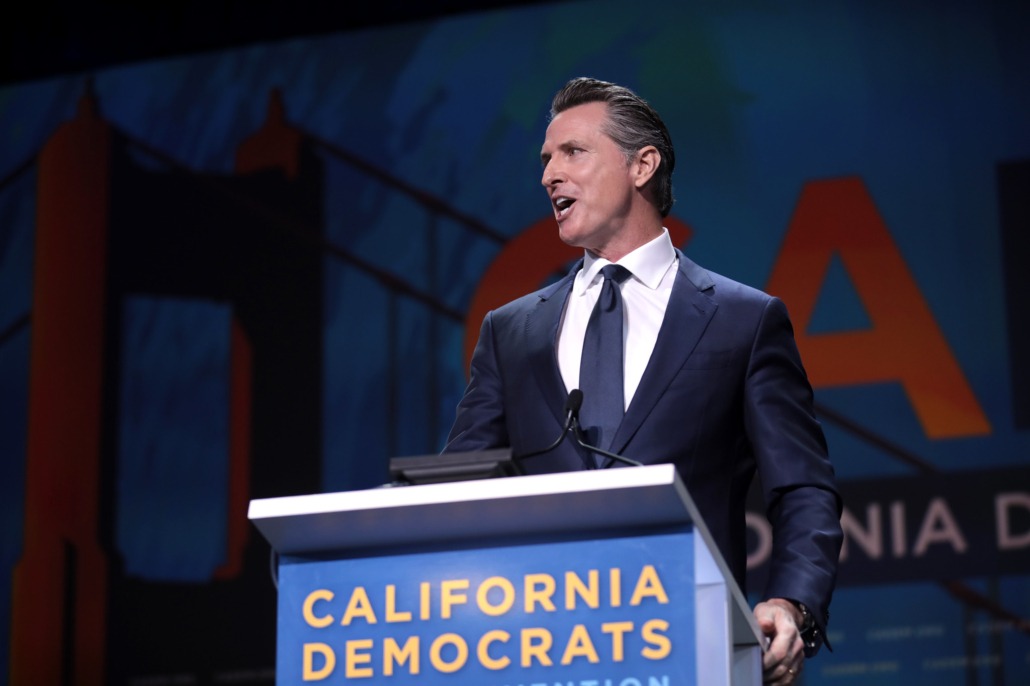 California Governor Gavin Newsom speaking at an event with California Democrats.