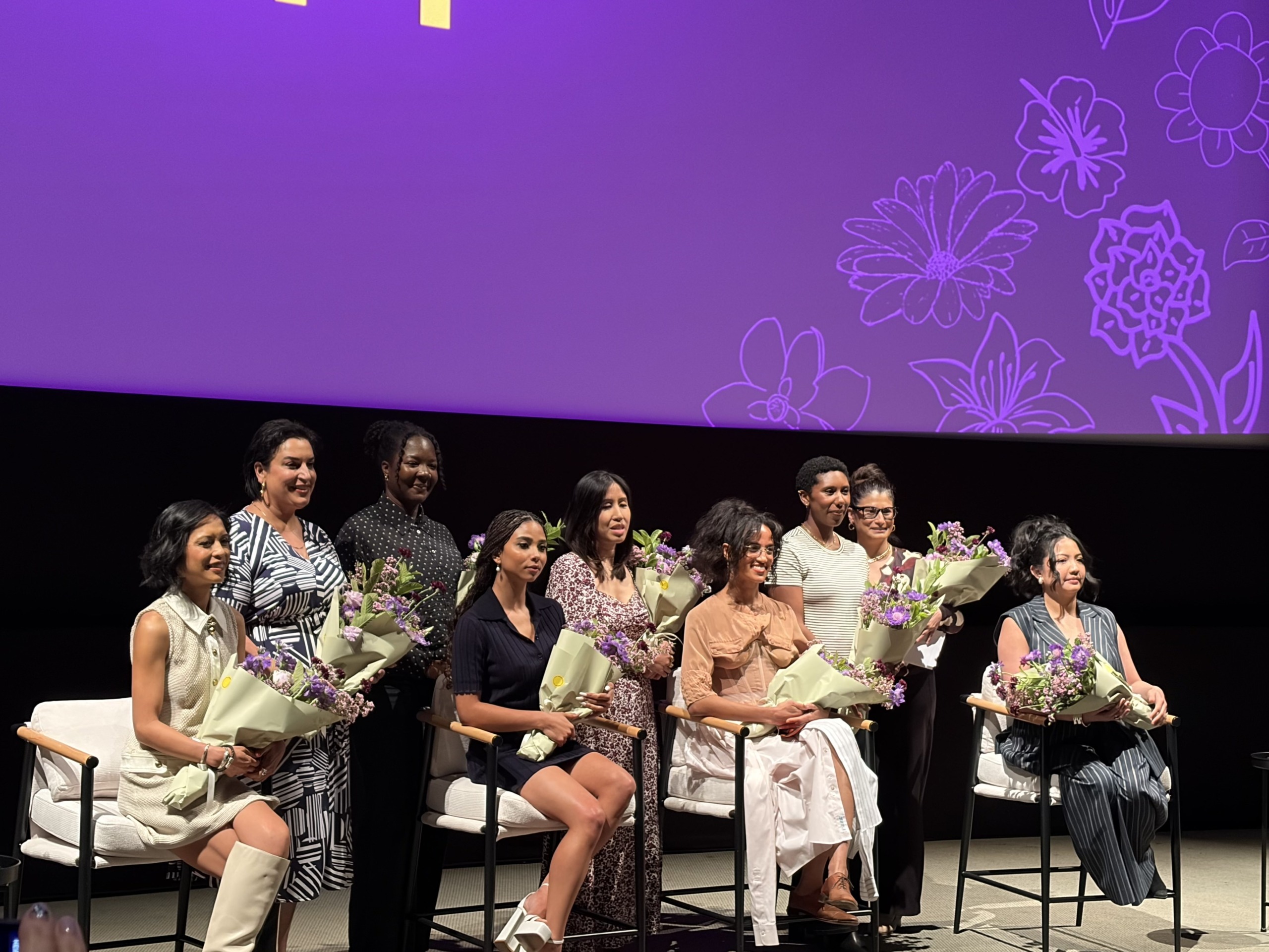 Women of "The Pitt" hold their flowers at the end of the panel.