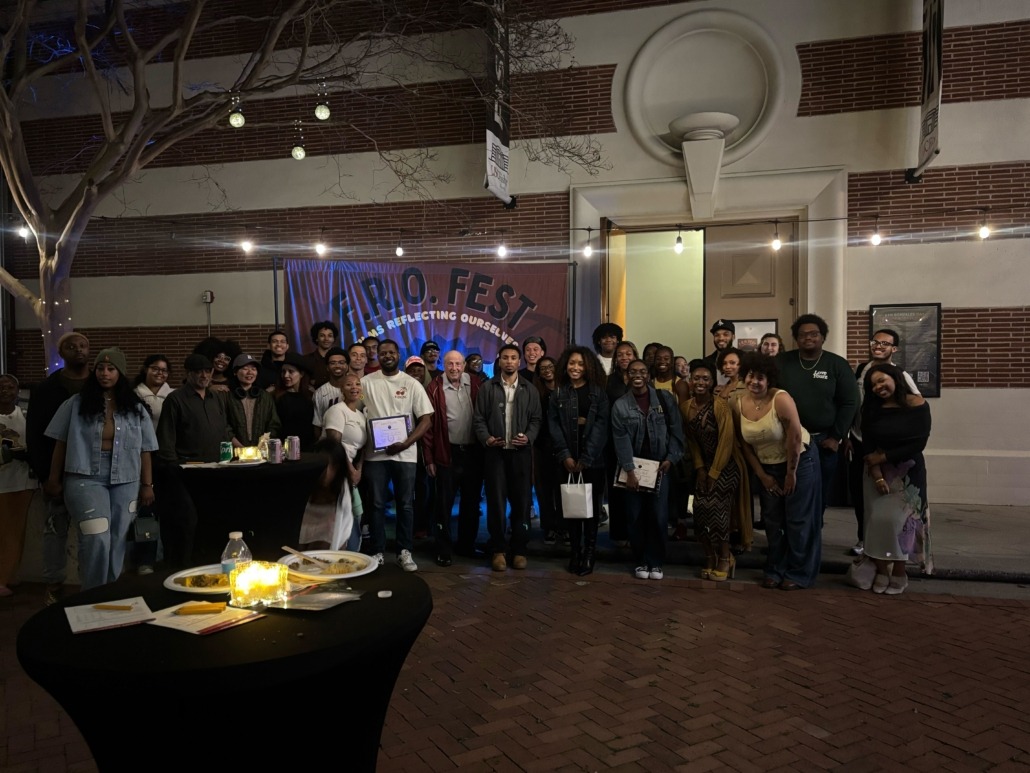 Cinematographers and members of AACS pose for photo outside of the event.