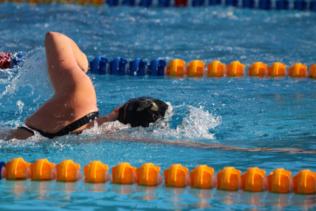 A USC swimmer swims freestyle