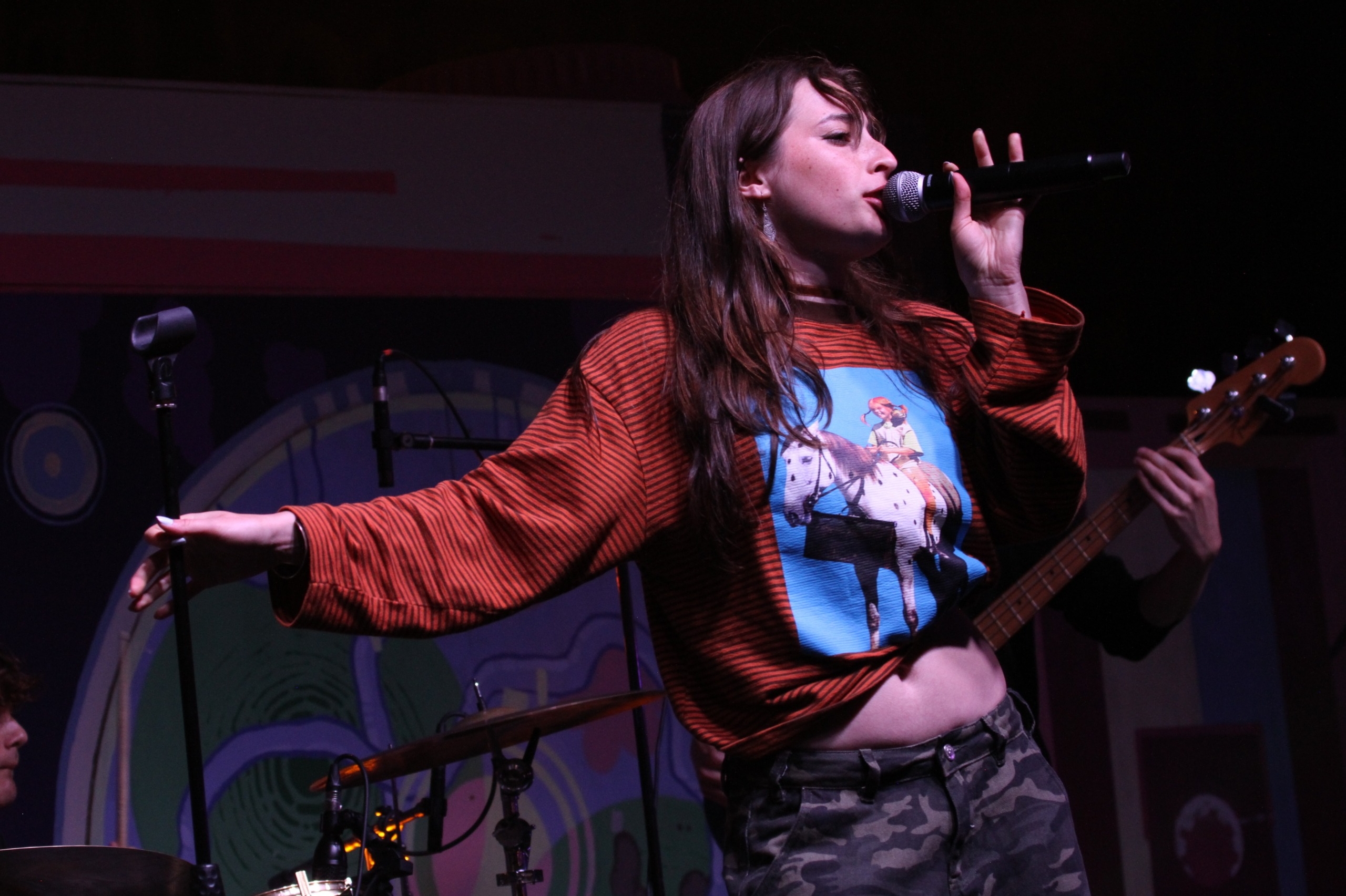 Ayla Claire singing on stage.