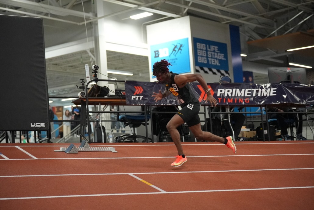 Senior sprinter Garrett Kaalund runs across the track