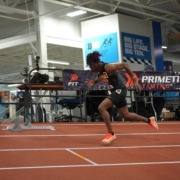 Senior sprinter Garrett Kaalund runs across the track